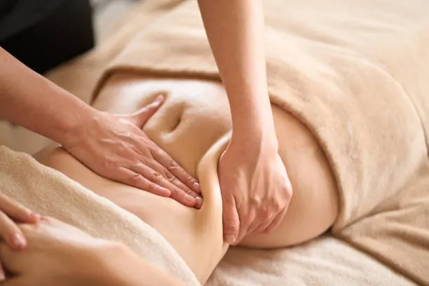 Gentle lymphatic drainage massage on arm