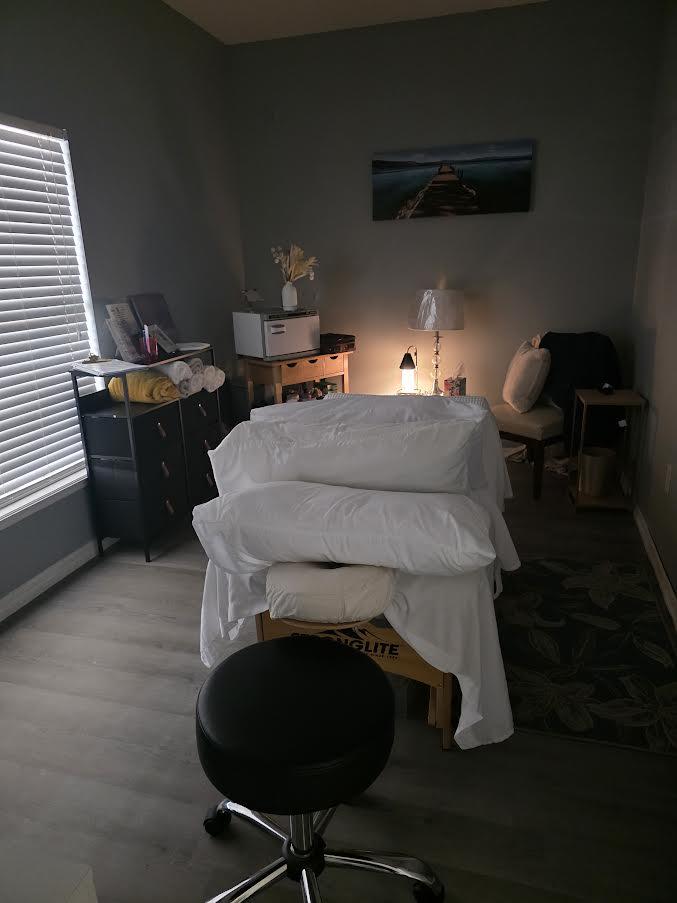 Private treatment room with massage table