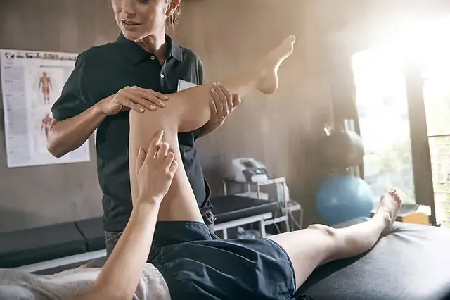 Sports therapy session on an athlete's leg